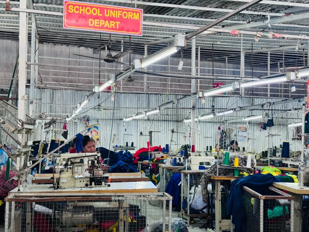 School uniform sewing department workstation floor at Pragati Venus Uniform